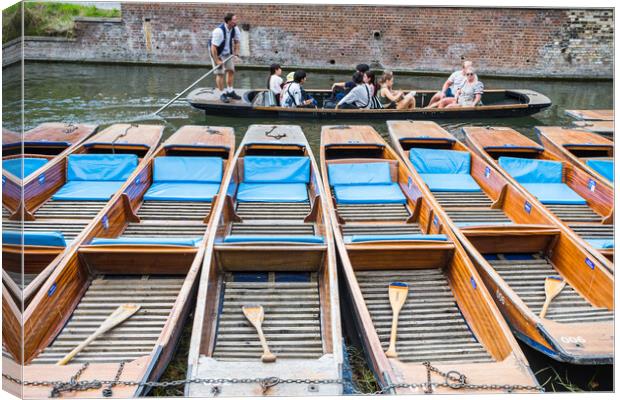 Tourists pass a row of punts Canvas Print by Jason Wells