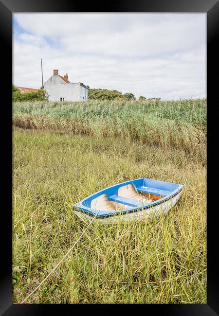 Boat tied at Brancaster Staithe Framed Print by Jason Wells