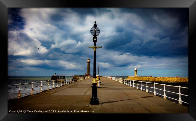 Whitby Lamps, piers, and Sunshine Framed Print by Cass Castagnoli