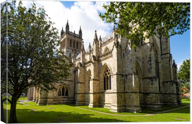 Selby Abbey bathed in summer sun Canvas Print by Glen Allen