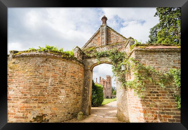 Oxburgh Hall through an arch Framed Print by Jason Wells