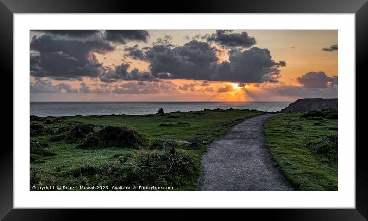 The sun setting at Kynance Cove, Cornwall Framed Mounted Print by Robert Mowat