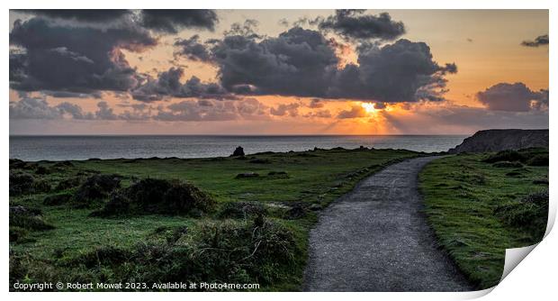 The sun setting at Kynance Cove, Cornwall Print by Robert Mowat