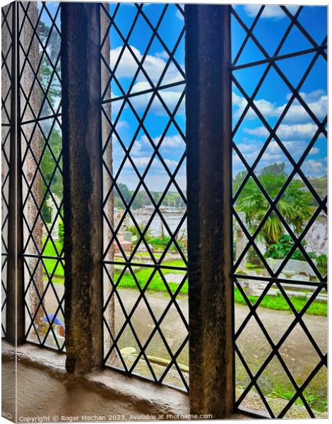 Reflective view through the church window. Canvas Print by Roger Mechan