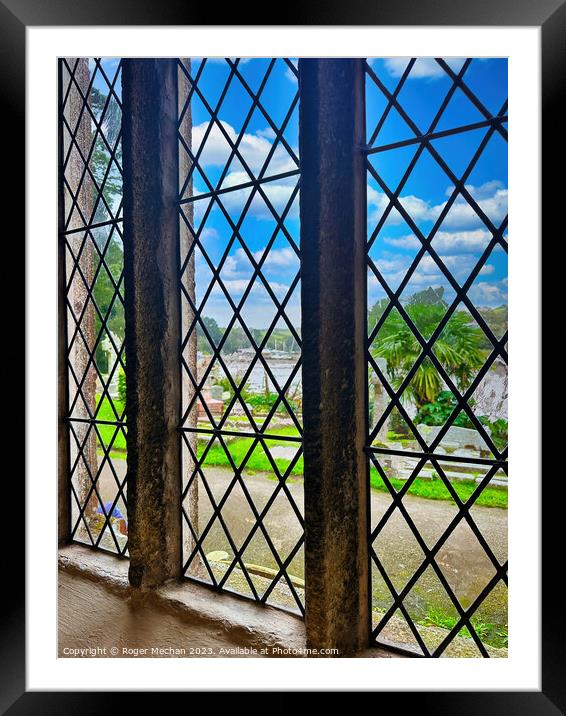 Reflective view through the church window. Framed Mounted Print by Roger Mechan