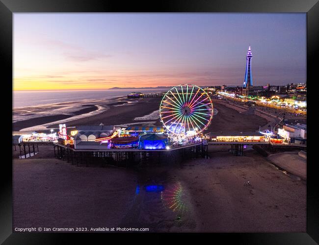Central Pier and Ferris Wheel at Sunset Framed Print by Ian Cramman