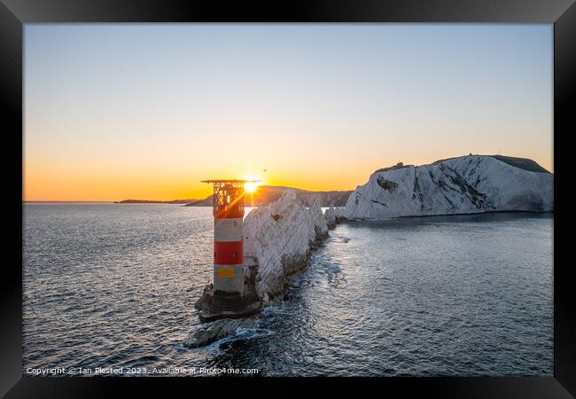 The Needles Lighthouse at dawn  Framed Print by Ian Plested