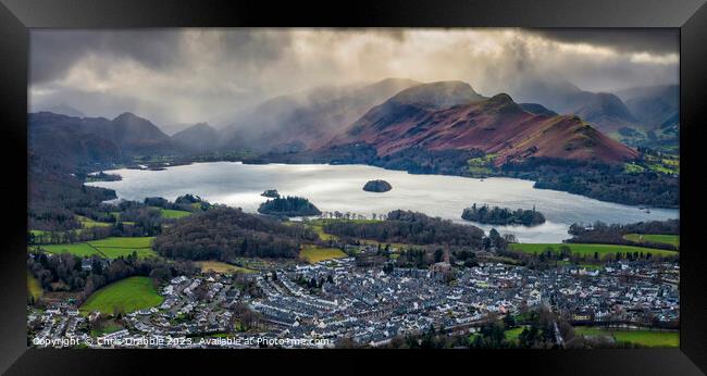 Keswick under storm clouds Framed Print by Chris Drabble