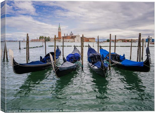 Gondolas moored near St Marks Square, Venice Canvas Print by Michael Shannon