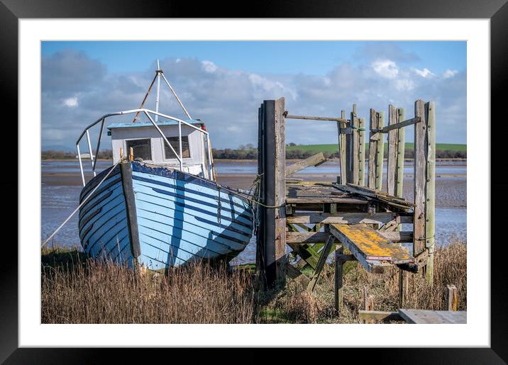 Blue boat by the jetty up at Skippool Creek Framed Mounted Print by Gary Kenyon