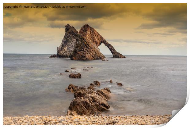 Bow Fiddle Rock is a natural sea arch near Portknockie on the no Print by Peter Stuart