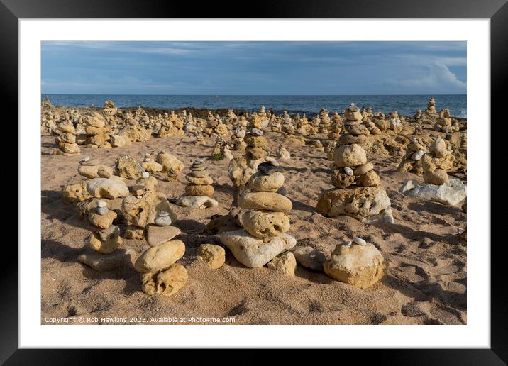 Oura beach stone stacks Framed Mounted Print by Rob Hawkins