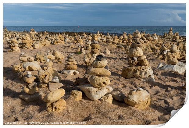 Oura beach stone stacks Print by Rob Hawkins