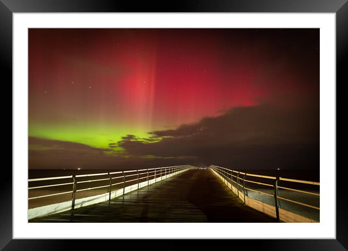 Aurora Borealis over Saltburn pier Framed Mounted Print by Kevin Winter