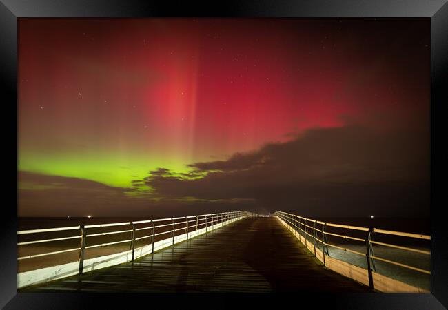 Aurora Borealis over Saltburn pier Framed Print by Kevin Winter