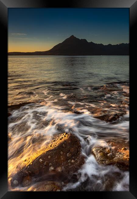 Waves crashing over the rocks on Elgol beach Framed Print by Kevin Winter
