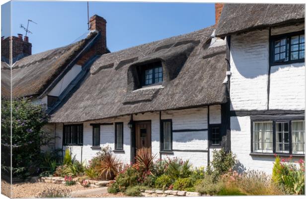 Thatched cottages in Wendover Canvas Print by Kevin Hellon