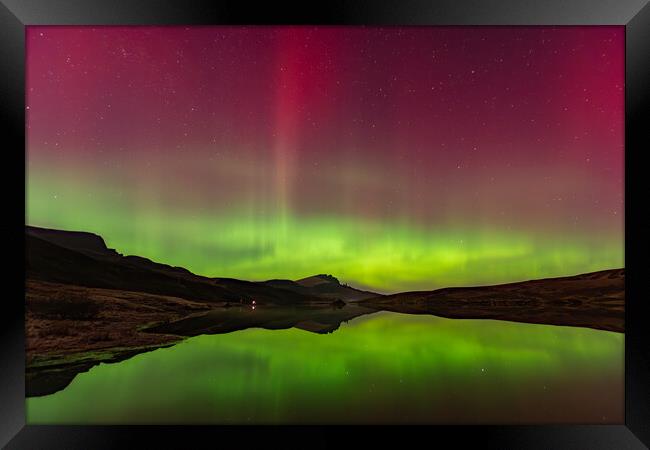 The Northern Lights reflected in Loch Fada Framed Print by Kevin Winter
