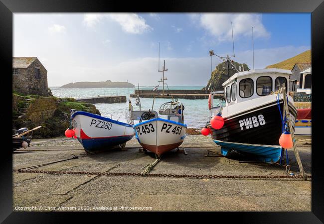 Fishing Boats in Mullion Cove pulled onto the slipway to avoid a storm . Framed Print by Chris Warham