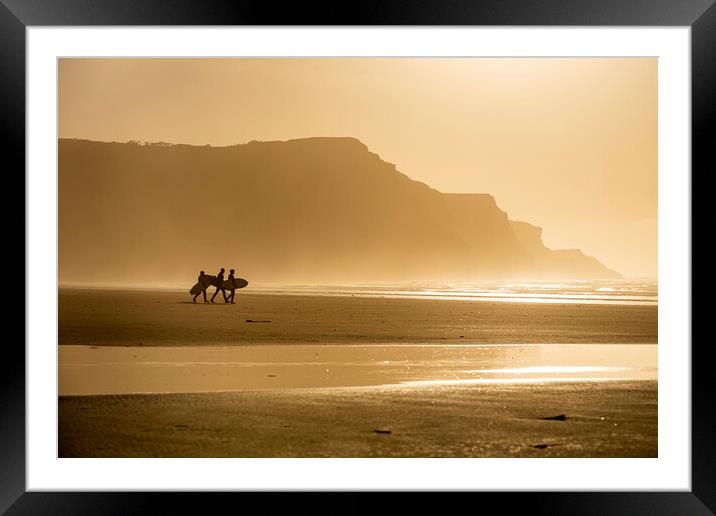 Surfers at sunset Framed Mounted Print by Robert Canis