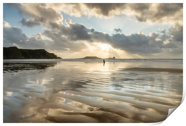Sunbeams over Rhossili Bay Print by Robert Canis