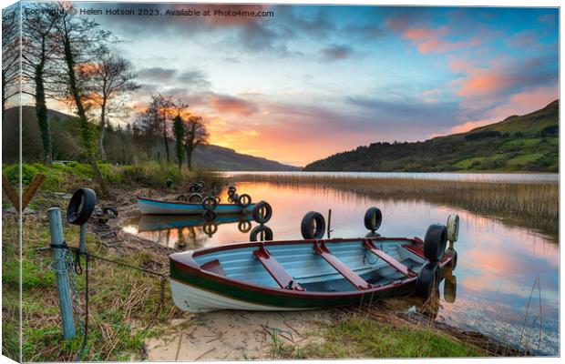 Beautiful sunrise over rowing boats at Glencar Lough Canvas Print by Helen Hotson