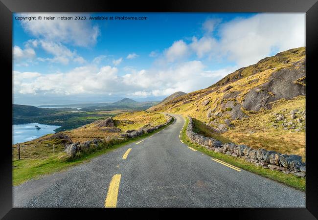 The single track road winding through the Healy Pass Framed Print by Helen Hotson