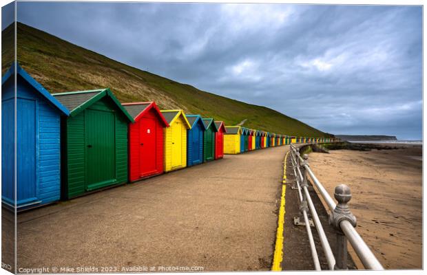 Whitby Beach Huts Canvas Print by Mike Shields