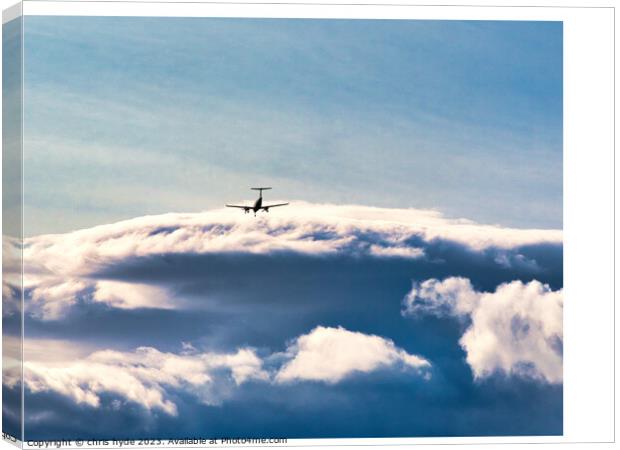 aircraft in the distance under storm clouds Canvas Print by chris hyde