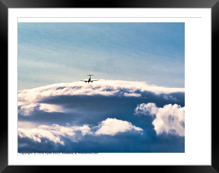 aircraft in the distance under storm clouds Framed Mounted Print by chris hyde