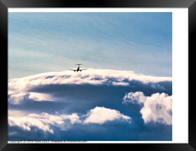 aircraft in the distance under storm clouds Framed Print by chris hyde