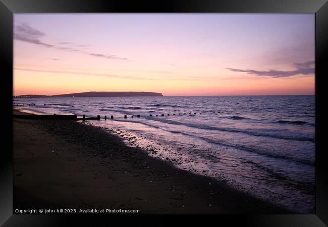 Sunrise over Sandown bay, Isle of Wight Framed Print by john hill