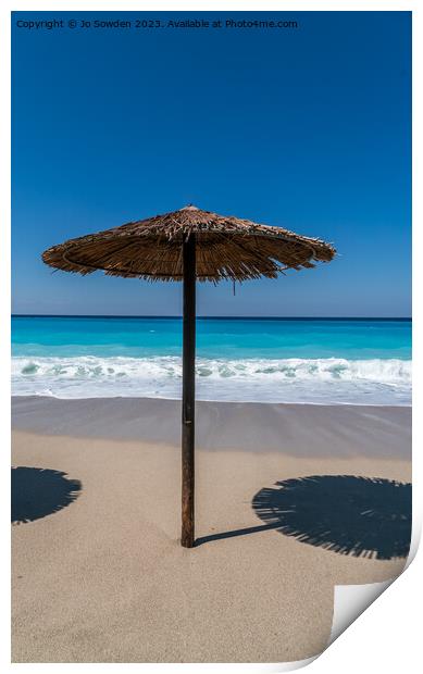 A straw topped Beach Umbrella on Lefkada Print by Jo Sowden