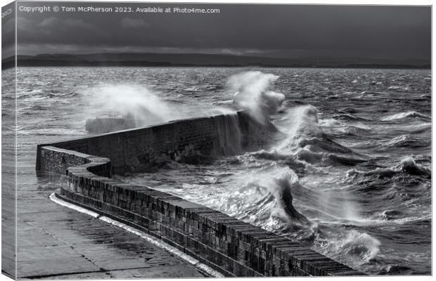 Huge waves break over Burghead pier during sea storm on the Moray Firth. Canvas Print by Tom McPherson
