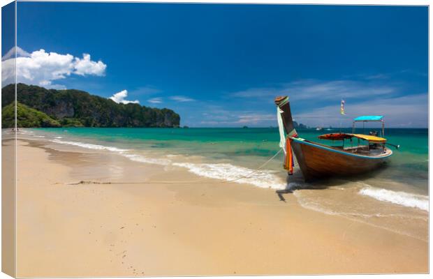 Long tail boat moored at Ao Nang Beach Canvas Print by Kevin Hellon