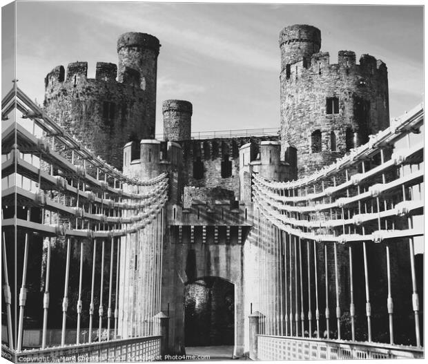 Conwy castle and toll bridge Black and White Canvas Print by Mark Chesters