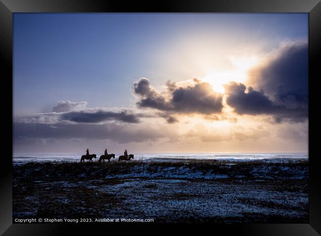 Silhouettes in the Storm: Icelandic Riders and Ponies Framed Print by Stephen Young