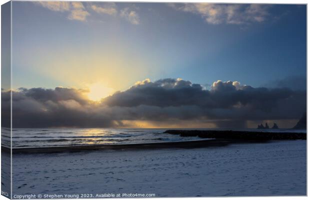 Arctic Elegance: Icelandic Sunset Over Snowy Shore Canvas Print by Stephen Young