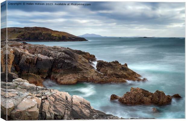 A long exposure of moody skies and rugged cliffs at Hushinish Canvas Print by Helen Hotson