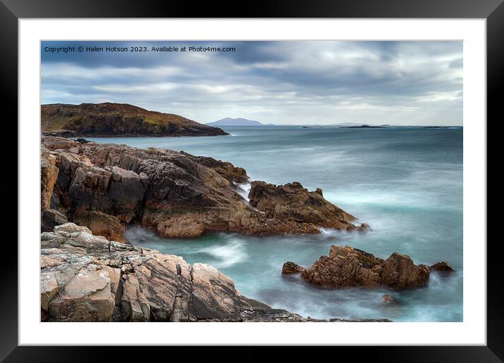 A long exposure of moody skies and rugged cliffs at Hushinish Framed Mounted Print by Helen Hotson