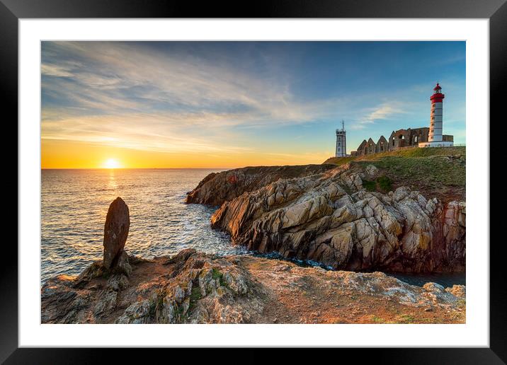 Beautiful sunset over the lighthouse at Saint Mathieu Framed Mounted Print by Helen Hotson