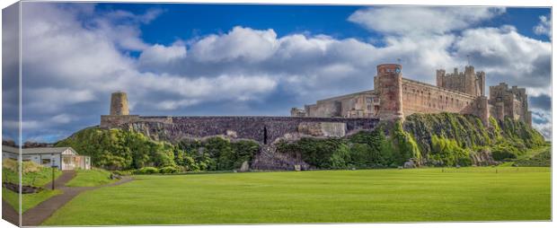 Bamburgh Castle and Green Canvas Print by Paul Grubb