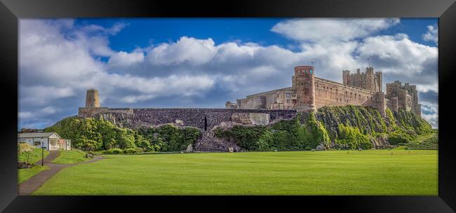 Bamburgh Castle and Green Framed Print by Paul Grubb