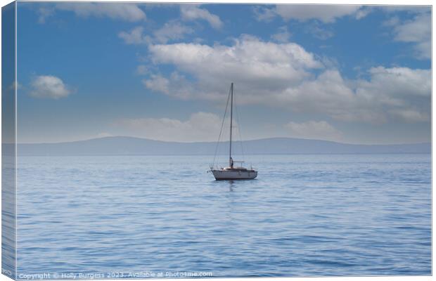One lonely yacht on the carm sea of Split, a town in Crosia, mountions in the back ground  Canvas Print by Holly Burgess
