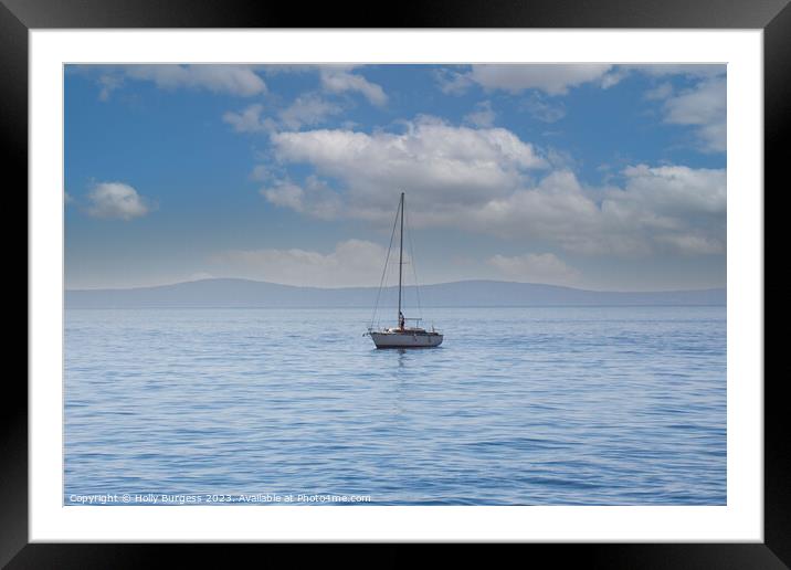 One lonely yacht on the carm sea of Split, a town in Crosia, mountions in the back ground  Framed Mounted Print by Holly Burgess