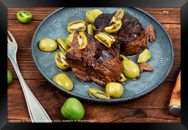 Fried ostrich steak with kiwi sauce Framed Print by Mykola Lunov Mykola