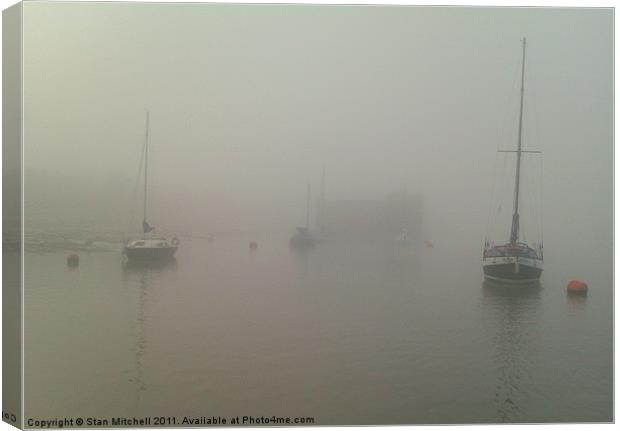 yachts moored in fog Canvas Print by Stan Mitchell