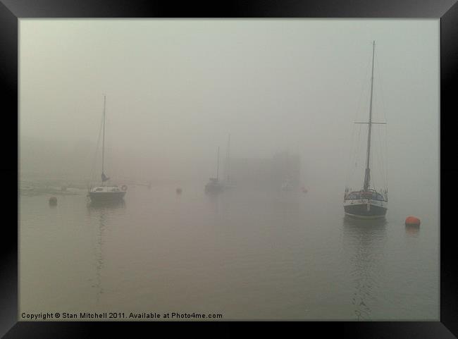 yachts moored in fog Framed Print by Stan Mitchell