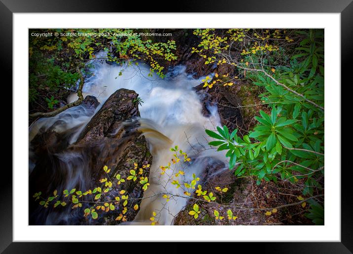 A waterfall surrounded by trees in Scotland Framed Mounted Print by A Chisholm