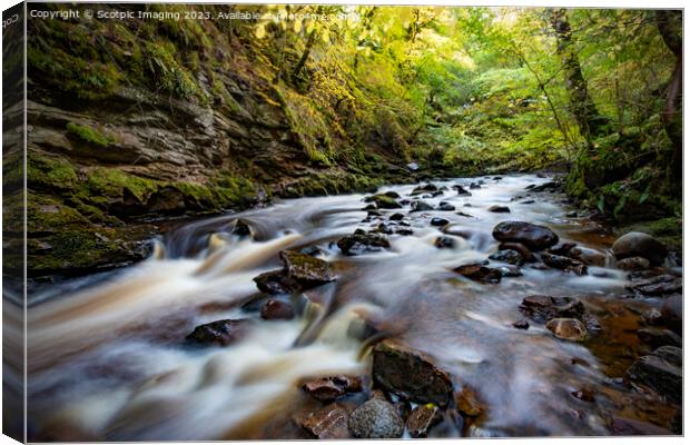 Slow exposure river with stones Canvas Print by A Chisholm